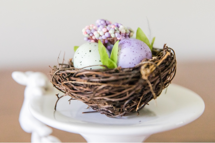 Miniature Easter Basket sitting on a white rabbit cake holder