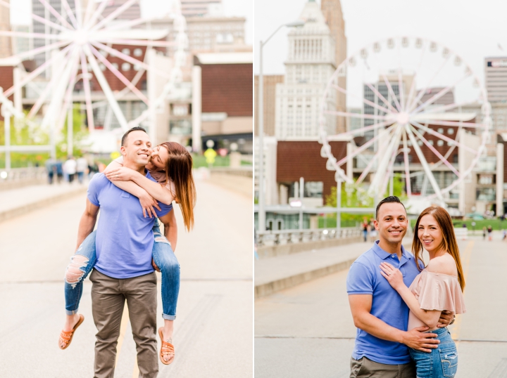 Man in blue polo shirt and woman in torn blue jeans and pink off the shoulder shirt posing in front of a ferris wheel in Cincinnati Ohio