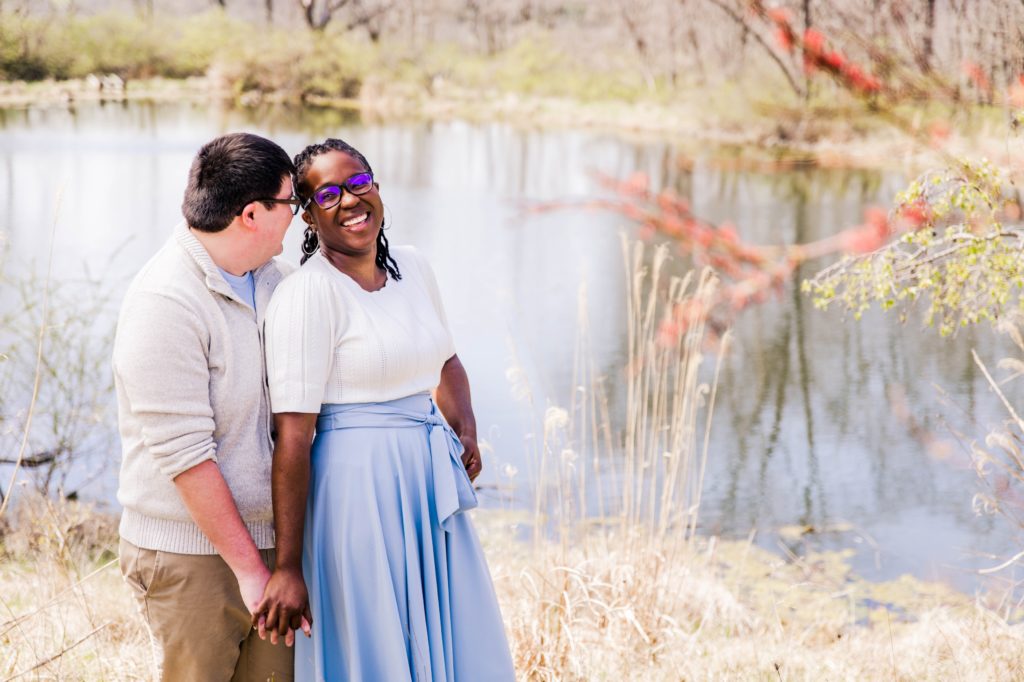 Kenny and Jonathan laughing in front of a pond during Pyramid Hill engagement session