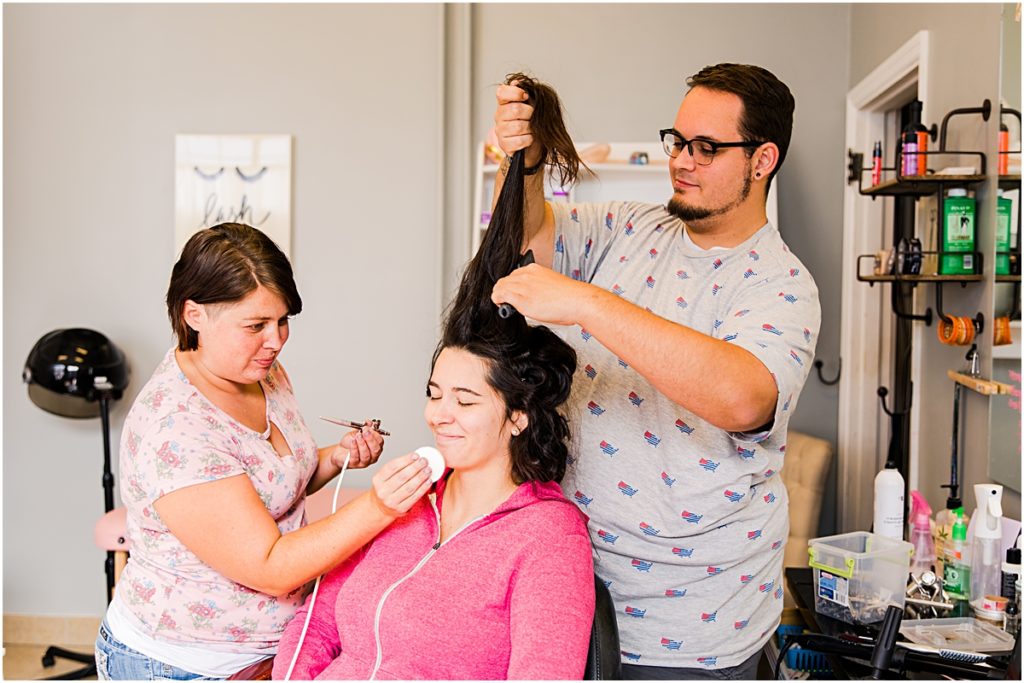Hair and Makeup Artist working with a bride for an Ohio engagement session 
