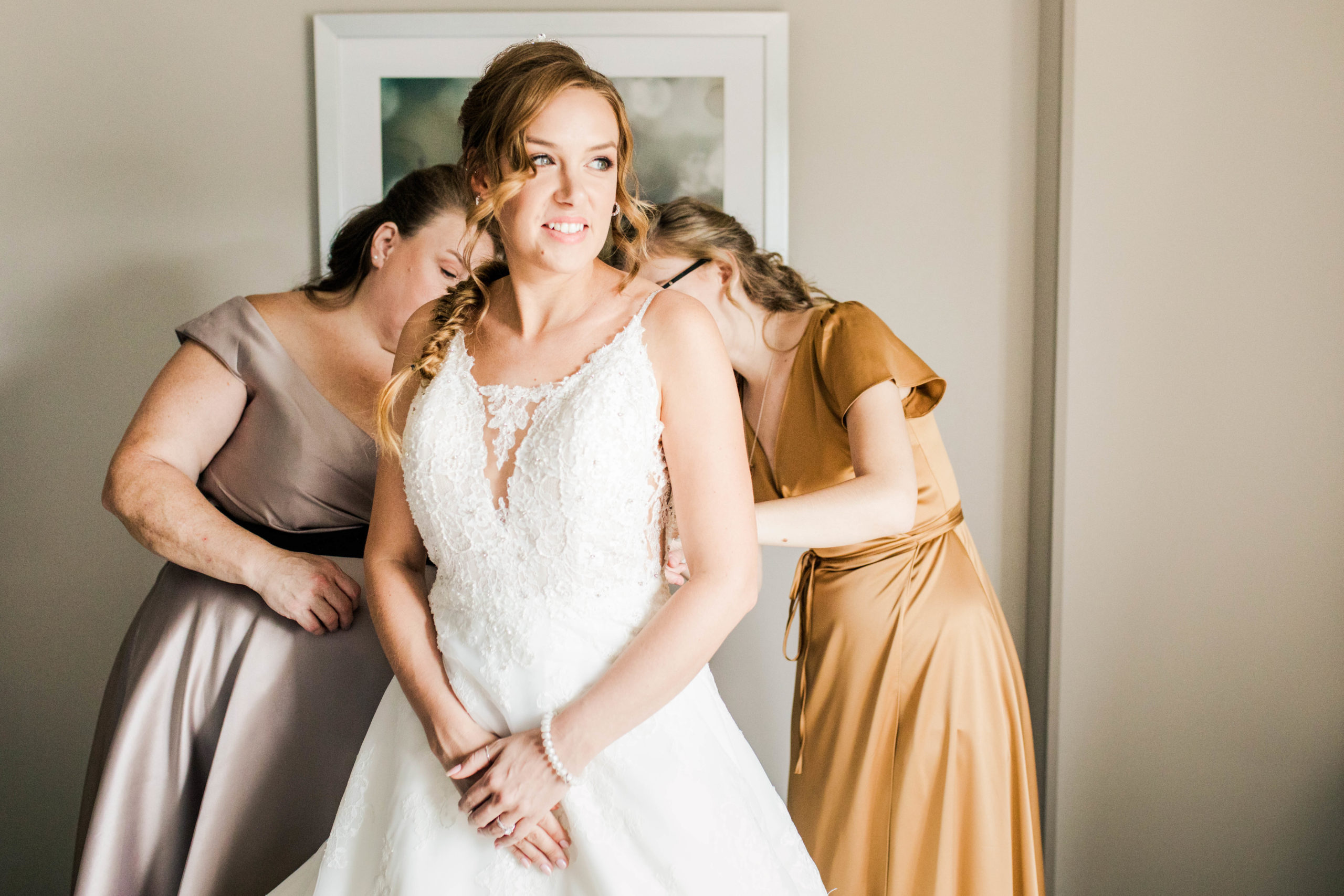 A bride getting ready in an ideal space for some beautiful bridal photography.