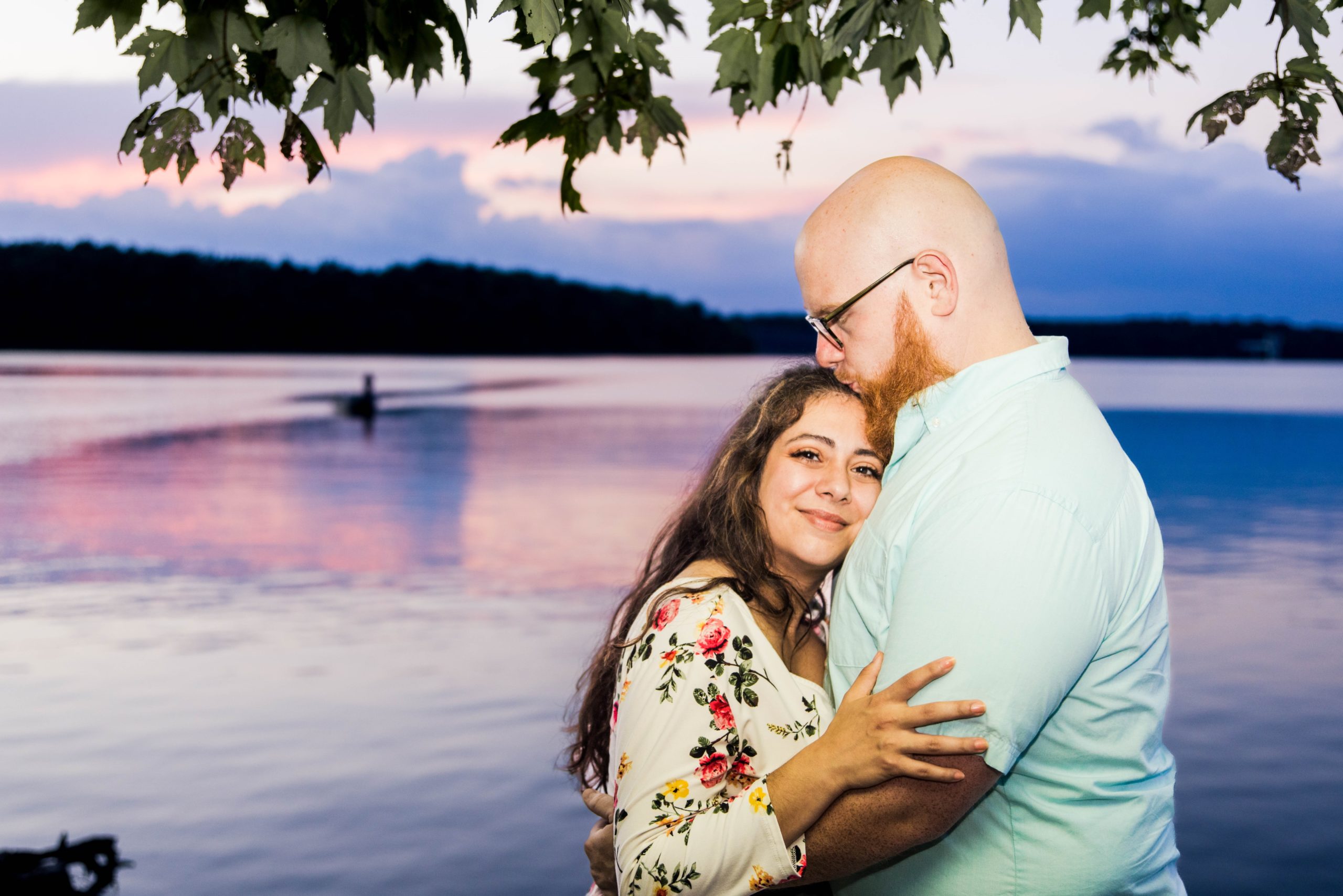Sunset photo of an engaged couple by the lake at East Fork State Park 
