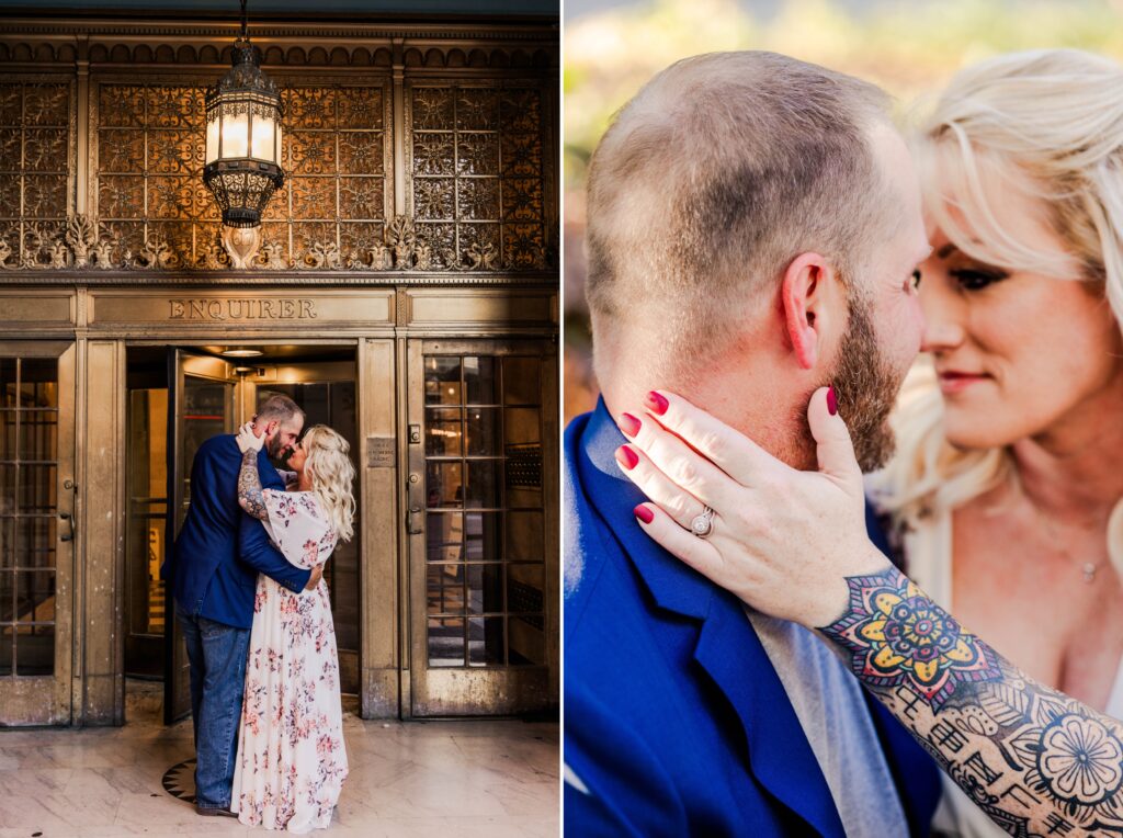 Tattooed engaged woman holidng the side of her fiance's face with her ring hand paired next to an engaged couple standing in front of historic building in downtown Cincinnati