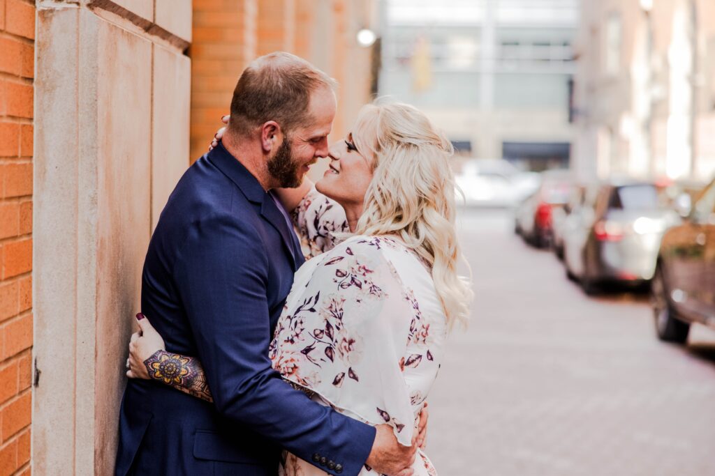 Close up of an engaged couple hugging in city engagement session