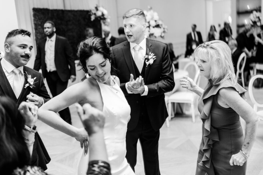 Bride and guest dancing on the dance floor during a recpetion