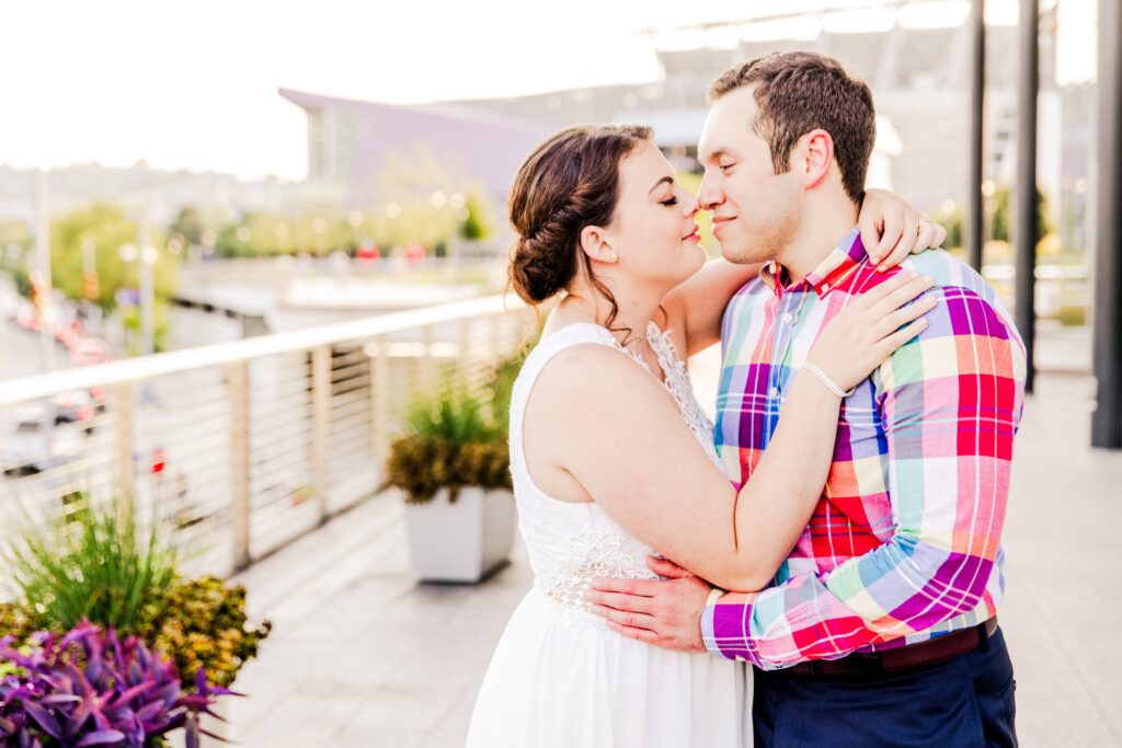 Couple almost kissing during golden hour engagegment session in downtown Cincinnati