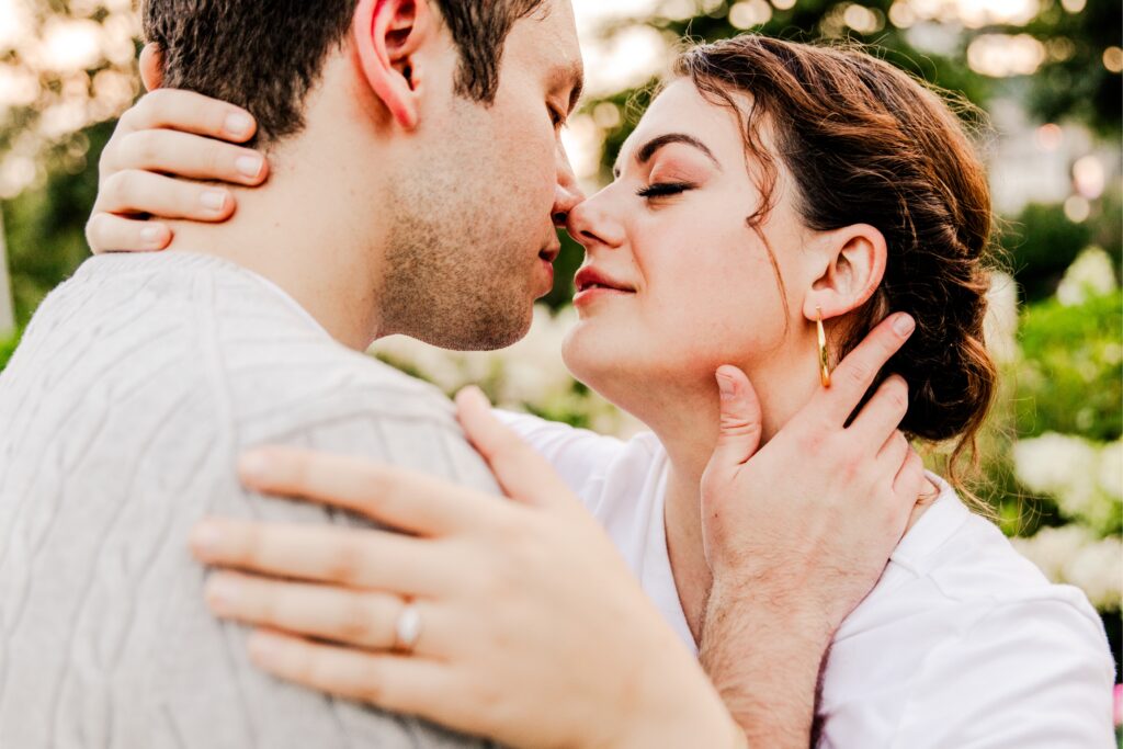 Romantic summer engagement photo during golden hour