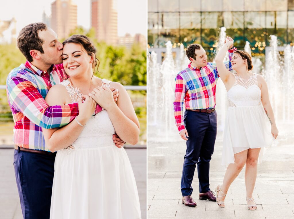 engaged couple snuggling and dancing in front of water feature at smale park cincinnati